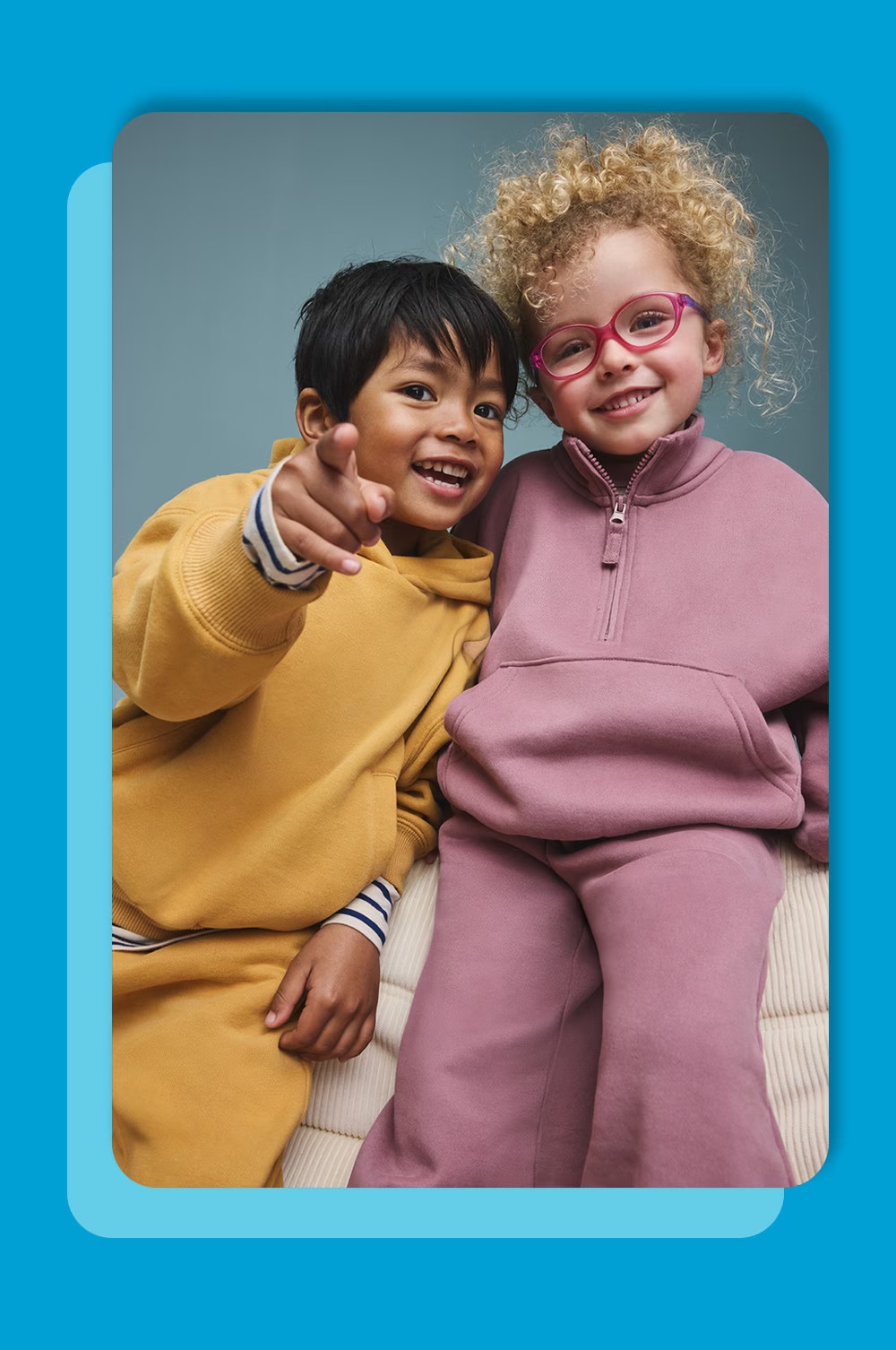 Kids wearing a hoodie and joggers.