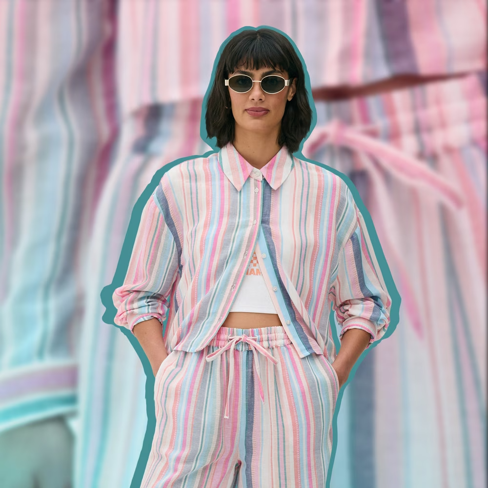 Model wearing a pink striped linen trouser set 